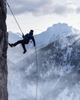 Altitude Sickness Explained: How to Prevent and Treat AMS on Your Next High-Altitude Hike - climber rappelling down snowy mountain