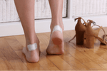 Blister Treatment on the Trail: Prevention and Care Guide for Hikers - woman applying bandages on blistered heels.
