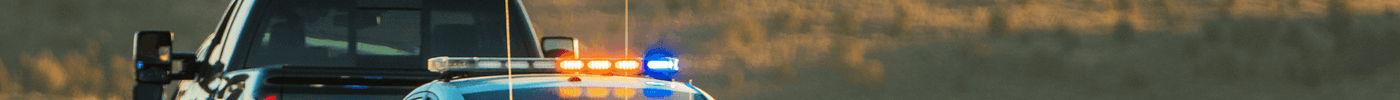 How Law Enforcement Agencies Should Procure IFAKs and Trauma Kits in Bulk: Police car assisting in emergency situation.