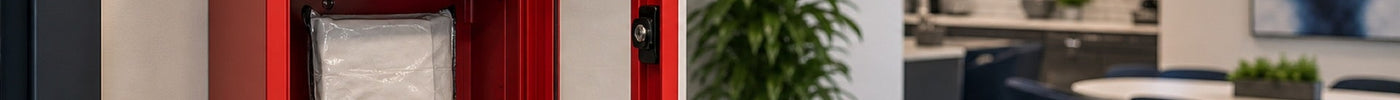 Office wall-mounted bleed control kit open and accessible for workplace public access readiness program