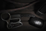 An assortment of tools including a knife and carabiners for law enforcement trauma kit configurations.