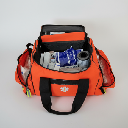 Open first responder jump bag filled with medical supplies for emergency situations.