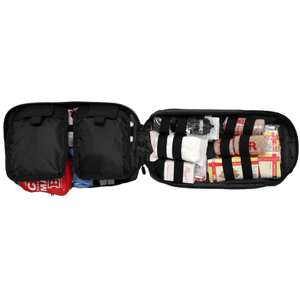 Open tactical trauma kit showing organized first aid supplies and tools for emergency medical response.