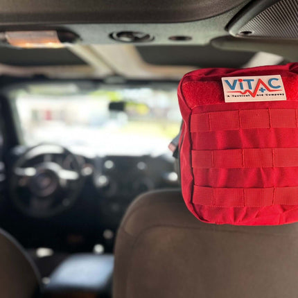 ViTAC adventurer first aid kit securely attached in vehicle, perfect for emergencies on outdoor adventures.