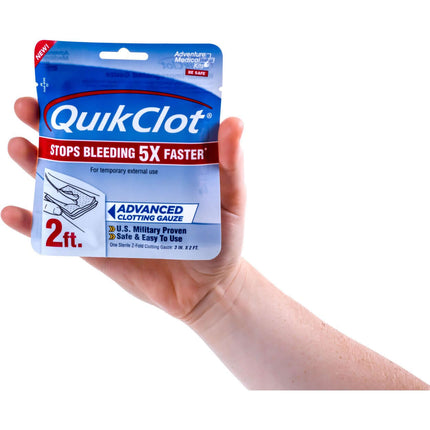 QuikClot Advanced Clotting Gauze package held in hand, 2ft, U.S. Military proven, stops bleeding 5x faster