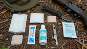 Hunting first aid kit with medical supplies for field trauma.