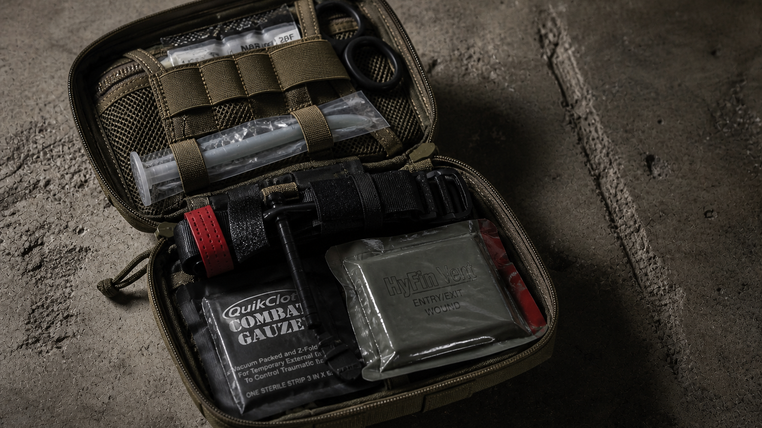 Bleed control kit components organized for workplace procurement — trauma-ready gear laid out on a professional surface