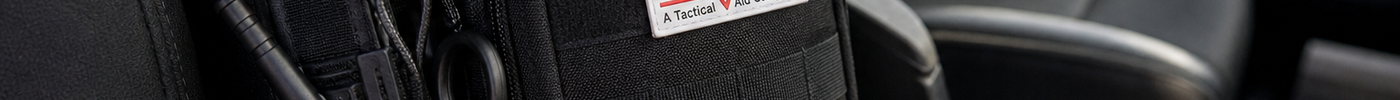 Where to carry a tourniquet: a tactical bag in a vehicle for quick access to emergency supplies.