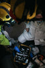 Emergency personnel reviewing a family first aid kit selection during a crisis.