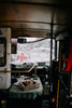 Interior of a damaged vehicle with first aid supplies, emphasizing the need for hemostatic agents for severe bleeding.
