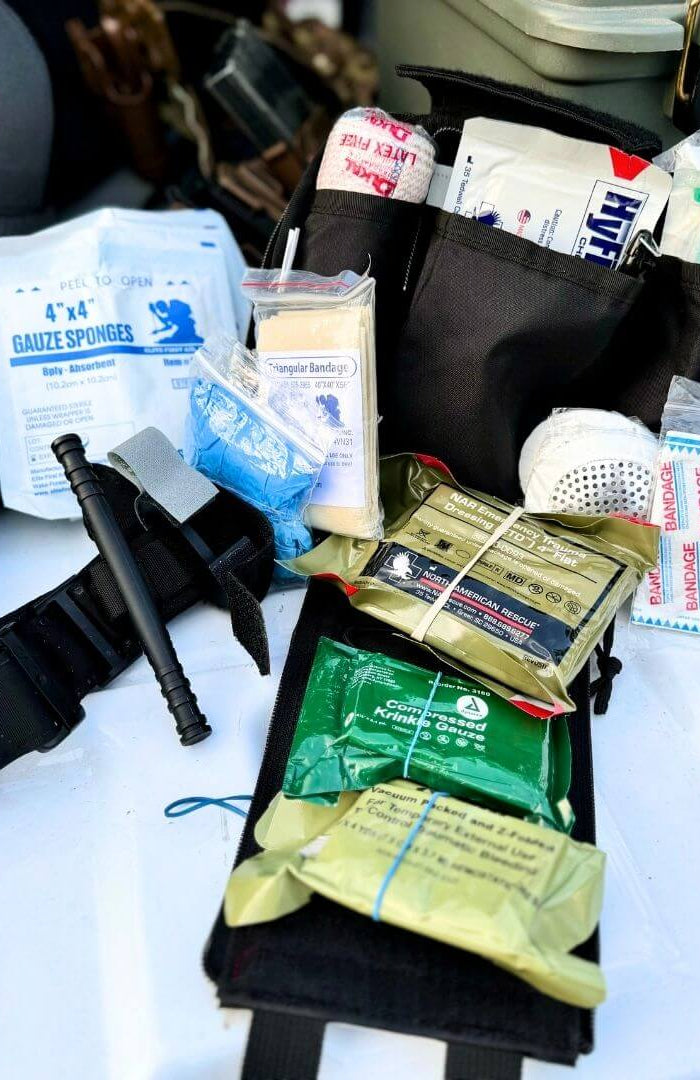 Emergency Medical Trauma Kits showcasing gauze sponges, bandages, and medical supplies for rapid bleeding control.