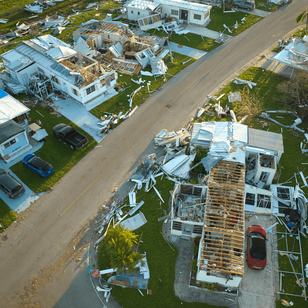 disaster preparedness kits damaged homes after natural disaster with debris and destruction in the area