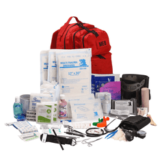 Image of trauma kits with chest seals, including multi-trauma dressings and medical supplies in a red backpack.