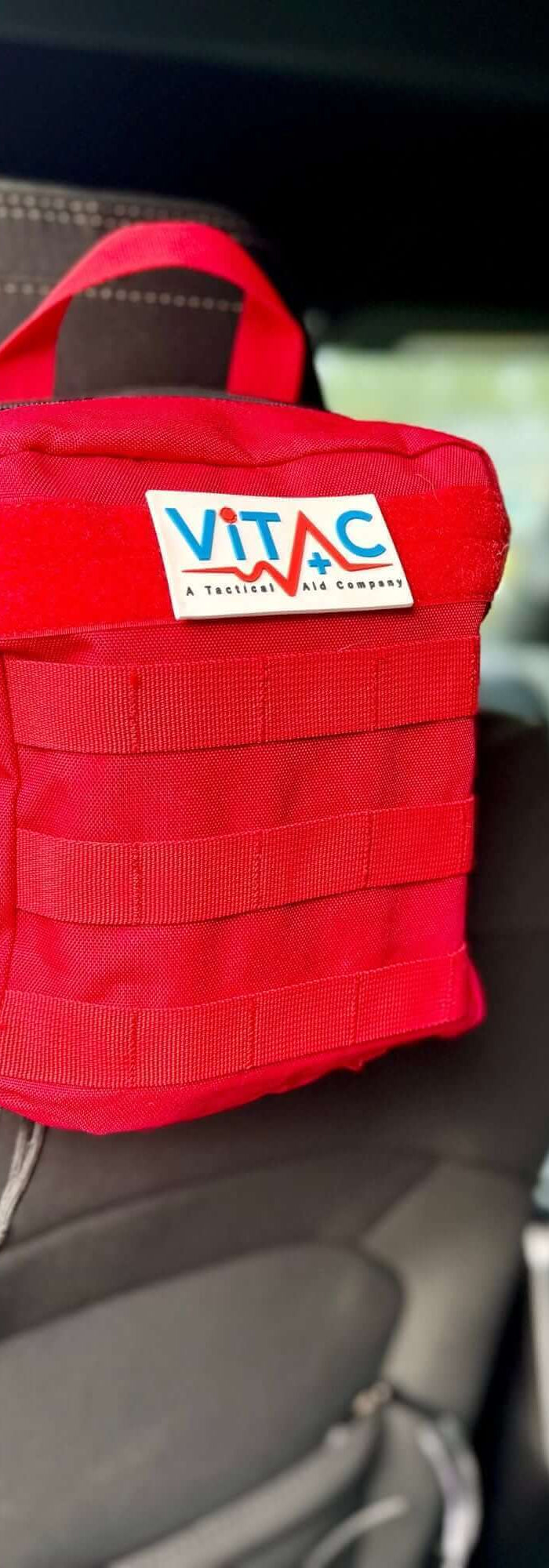 Vehicle & Marine Kits - compact first aid kit mounted on car seat for emergencies.