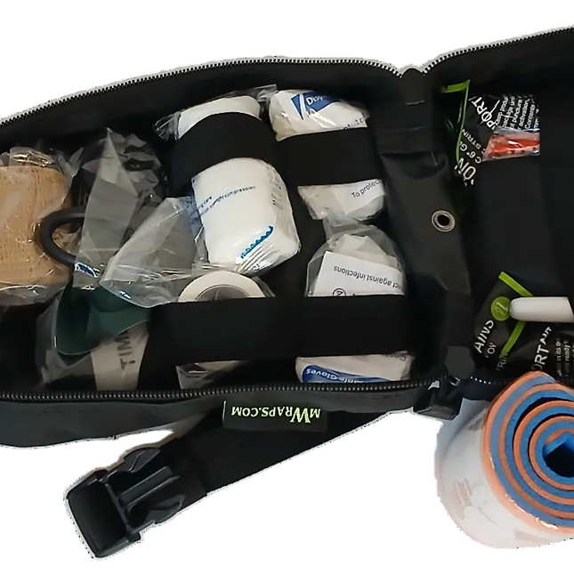 First aid kit with various supplies on a white background