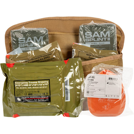 First aid kit with various medical supplies including SAM splints and trauma dressing on a white background.