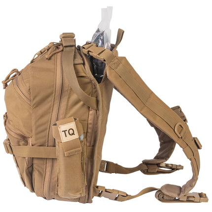 Tan tactical backpack with multiple straps and a 'TQ' tag on a white background