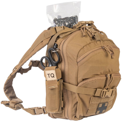 Tan tactical backpack with supplies on a white background