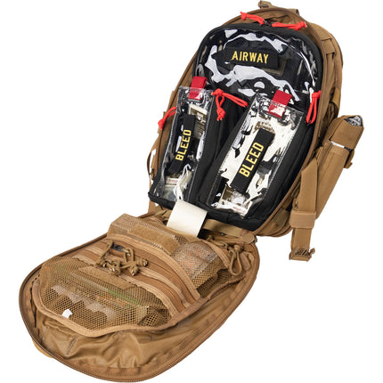 K-9 Mini Medic Kit interior showing medical supplies including bleed control and airway components in a tactical backpack.