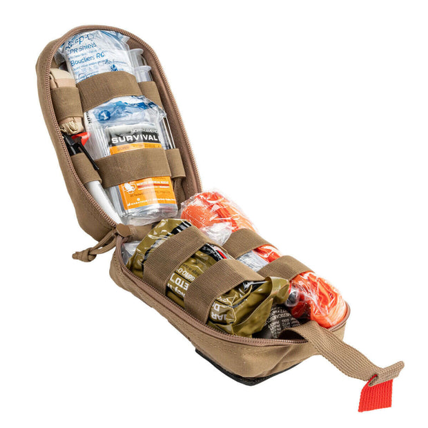 Solo IFAK contents including trauma supplies and survival gear in a compact first aid kit.
