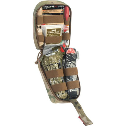 Tactical Operator Response Kit contents displayed in a compact first aid pouch with essential medical supplies.
