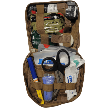 Open Enhanced Individual First Aid Kit showing medical supplies, scissors, and trauma essentials.