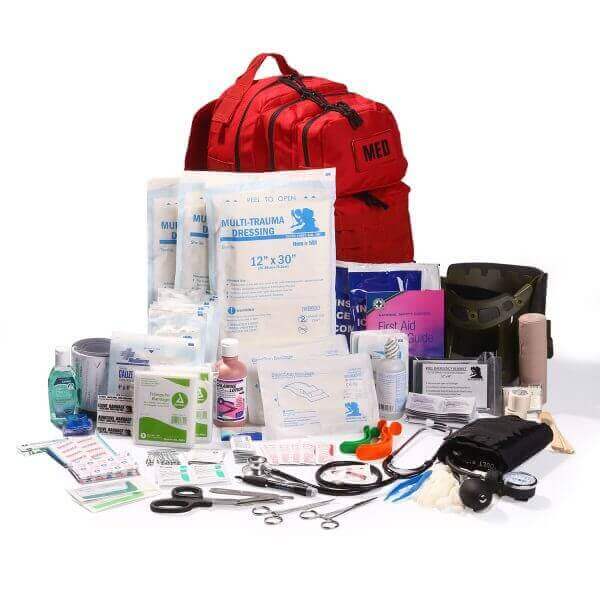 Flat lay of the EFA Tactical Trauma Kit – Advanced with military-grade components including a tourniquet, chest seals, trauma shears, hemostatic gauze, and compressed gauze. Displayed in a rugged MOLLE-compatible pouch, ideal for tactical responders, law enforcement, preppers, and military use. Emergency trauma care gear designed for the Golden Hour.