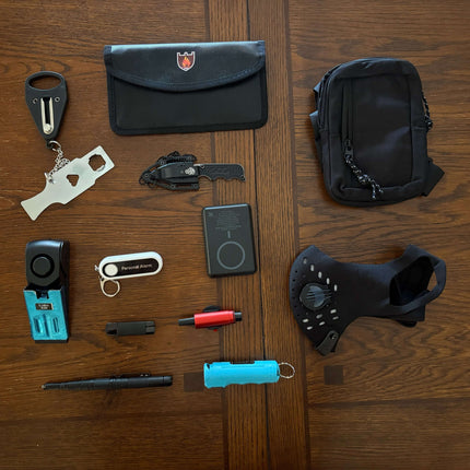Image of The Stay Safe Self Defense Kit tools including a personal alarm, tactical pen, and power bank.