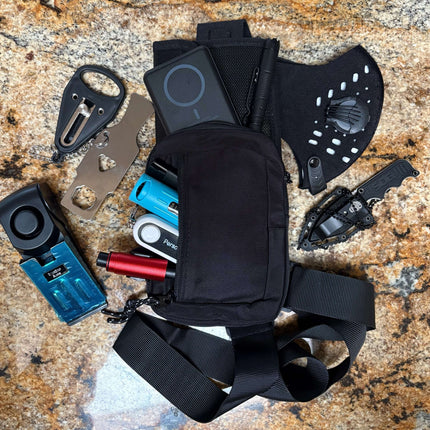 The Stay Safe Self Defense Kit with personal alarm, glass breaker, tactical pen, and pouch.