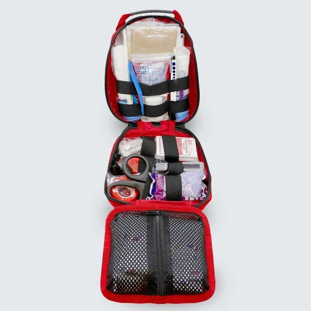 Open Small Rip Away Tactical Trauma Kit showing first aid supplies and tools for emergency response.