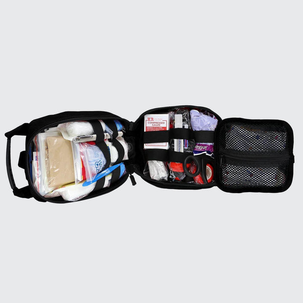 Open Small Rip Away Tactical Trauma Kit showing organized first aid supplies and life-saving tools.
