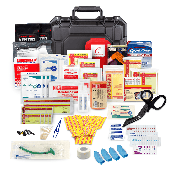 Waterproof medical kit contents including tourniquet, trauma dressings, scissors, and assorted first aid supplies.