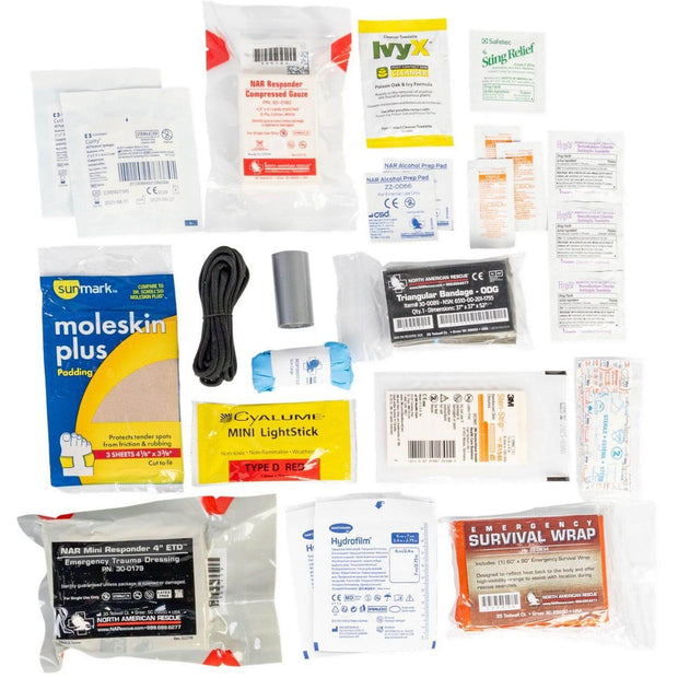 Outdoor Adventure Kit with first aid supplies, including bandages and survival gear for emergencies.