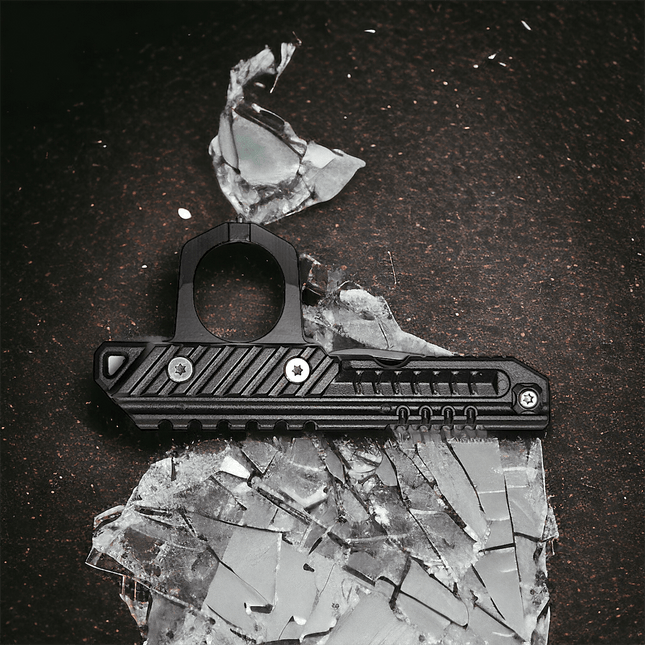 3-in-1 rescue tool on shattered glass, showcasing window breaker for emergency situations.