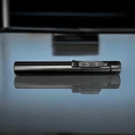 ONE SHEAR® XPE+COB USB-C rechargeable magnetic penlight resting on a reflective surface.