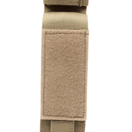 Brown tourniquet holster for first responders designed for easy access and secure storage of medical tools.