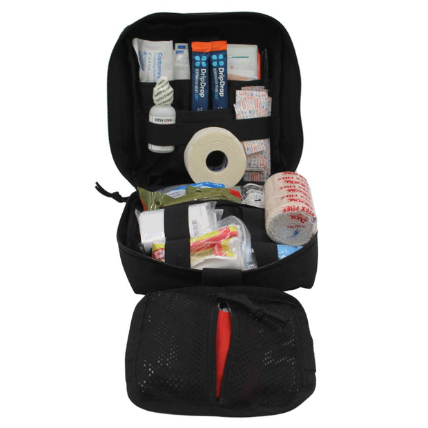 Open adventurer first aid kit displaying trauma tools and supplies in a water-resistant pouch.