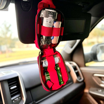 ViTAC EDC Trauma Kit hanging in a car, showcasing essential medical supplies for emergency care.