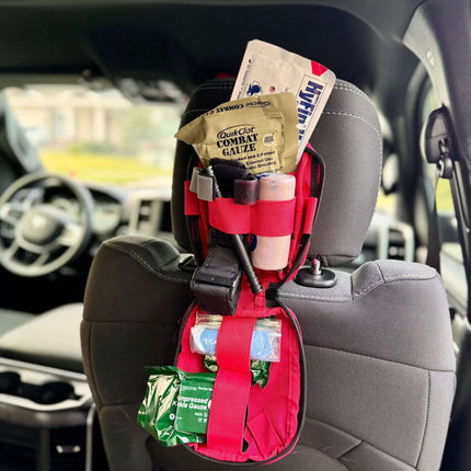 EDC Trauma Kit mounted on car seat headrest, featuring essential medical supplies for emergency care.