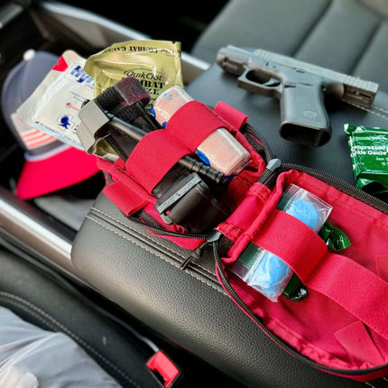 ViTAC EDC Trauma Kit with medical supplies and handgun on a car seat, ideal for emergency readiness.