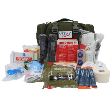 Advanced Adventurer First Aid Kit displayed with various medical supplies and a weather-resistant bag.