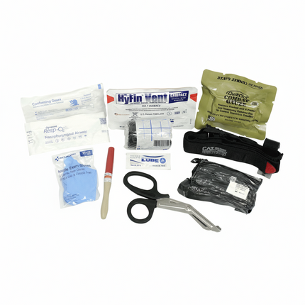 First aid kit with various supplies including bandages, scissors, and pliers on a white background