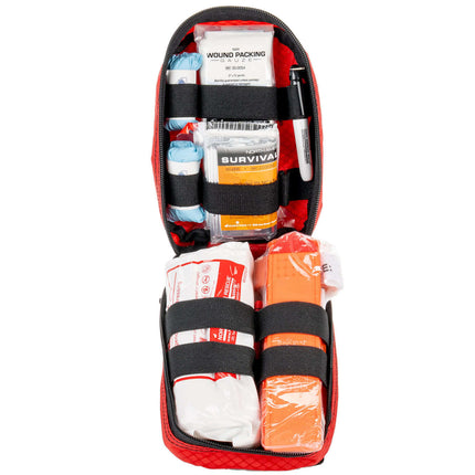 Individual Bleeding Control Kit with various medical supplies in a compact red bag for emergency use.