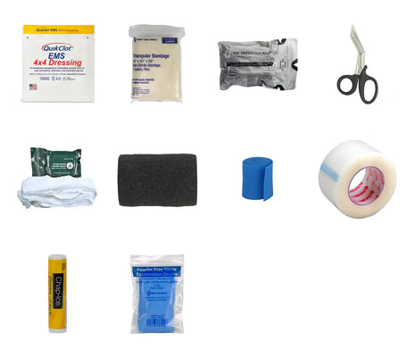 Collection of medical supplies including bandages, tape, and scissors on a white background