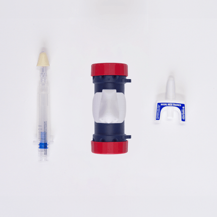 MITS Composite Trainer Kit components including a syringe and nasal med trainer for practicing medical procedures.