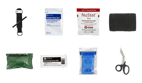 Collection of medical supplies including bandages, scissors, and a tourniquet on a white background