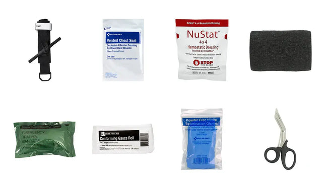 Collection of medical supplies including bandages, scissors, and a tourniquet on a white background