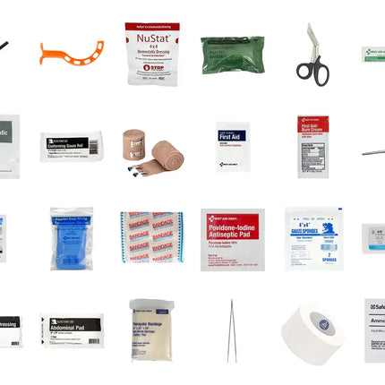 Collection of medical supplies including bandages, antiseptic wipes, and scissors on a white background.