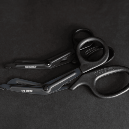 Lightweight medical scissors for EMT, featuring black non-stick coating and ergonomic handles from ONE SHEAR®.