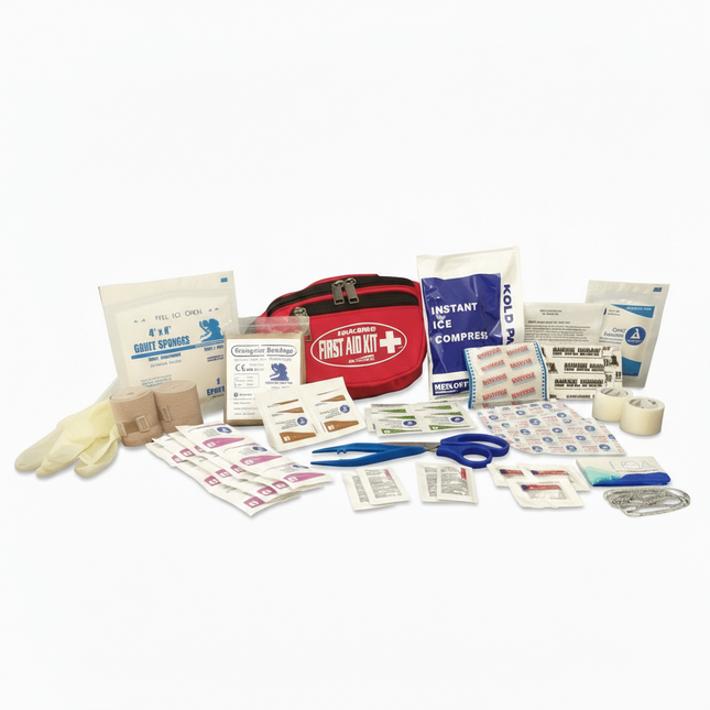 Collection of first aid supplies including a red kit on a black background